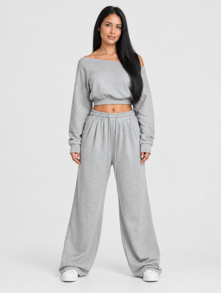 Woman wearing a grey off-shoulder long sleeve top and wide-leg pants set, front view