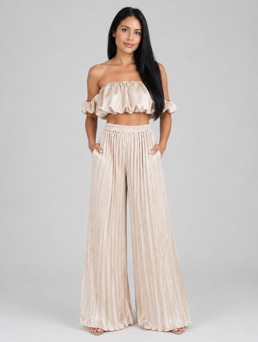 Woman wearing a beige pleated ruffle top and wide-leg pants two-piece set, front view
