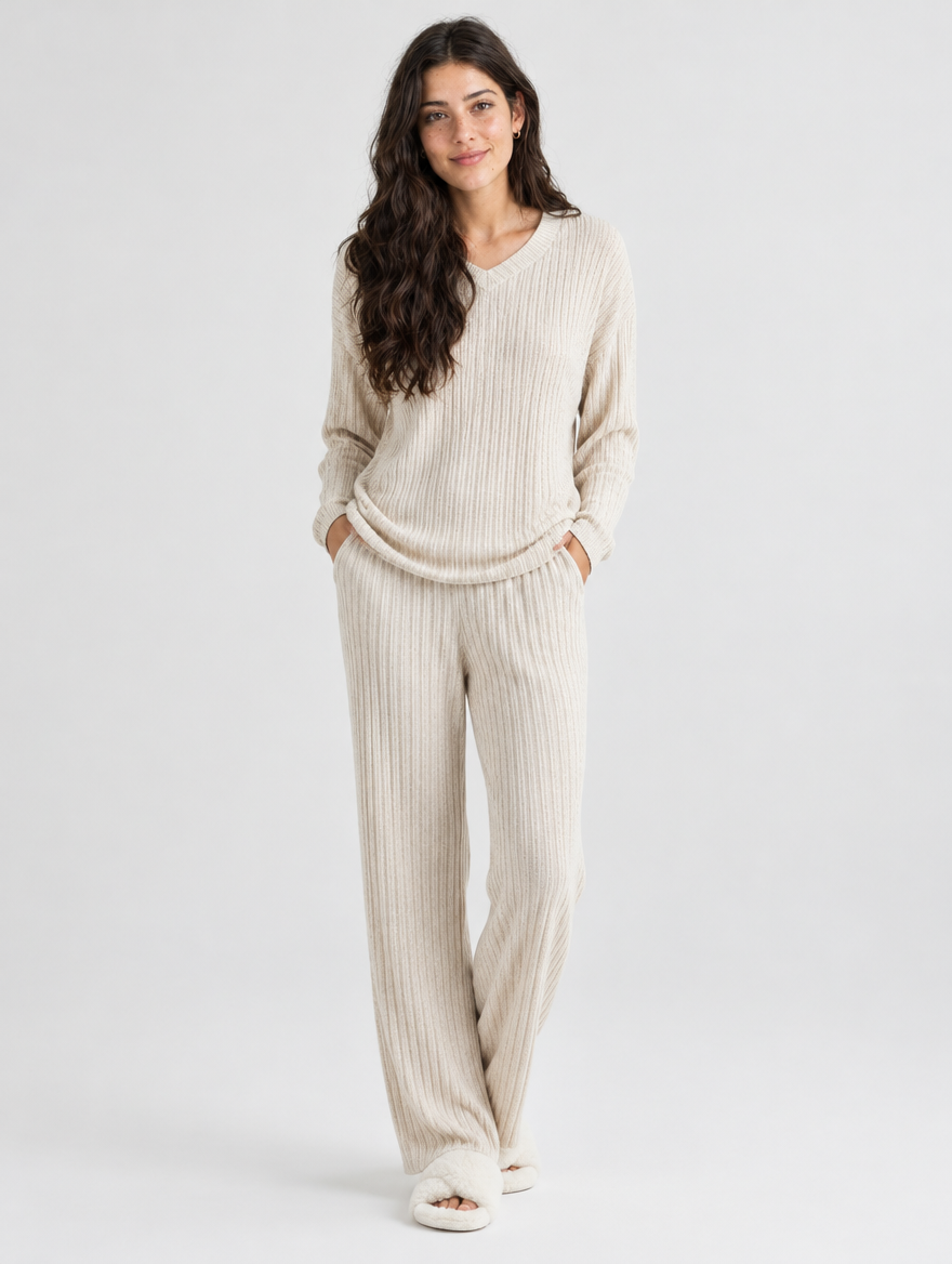 Woman wearing a beige ribbed knit long sleeve pajama set, front view